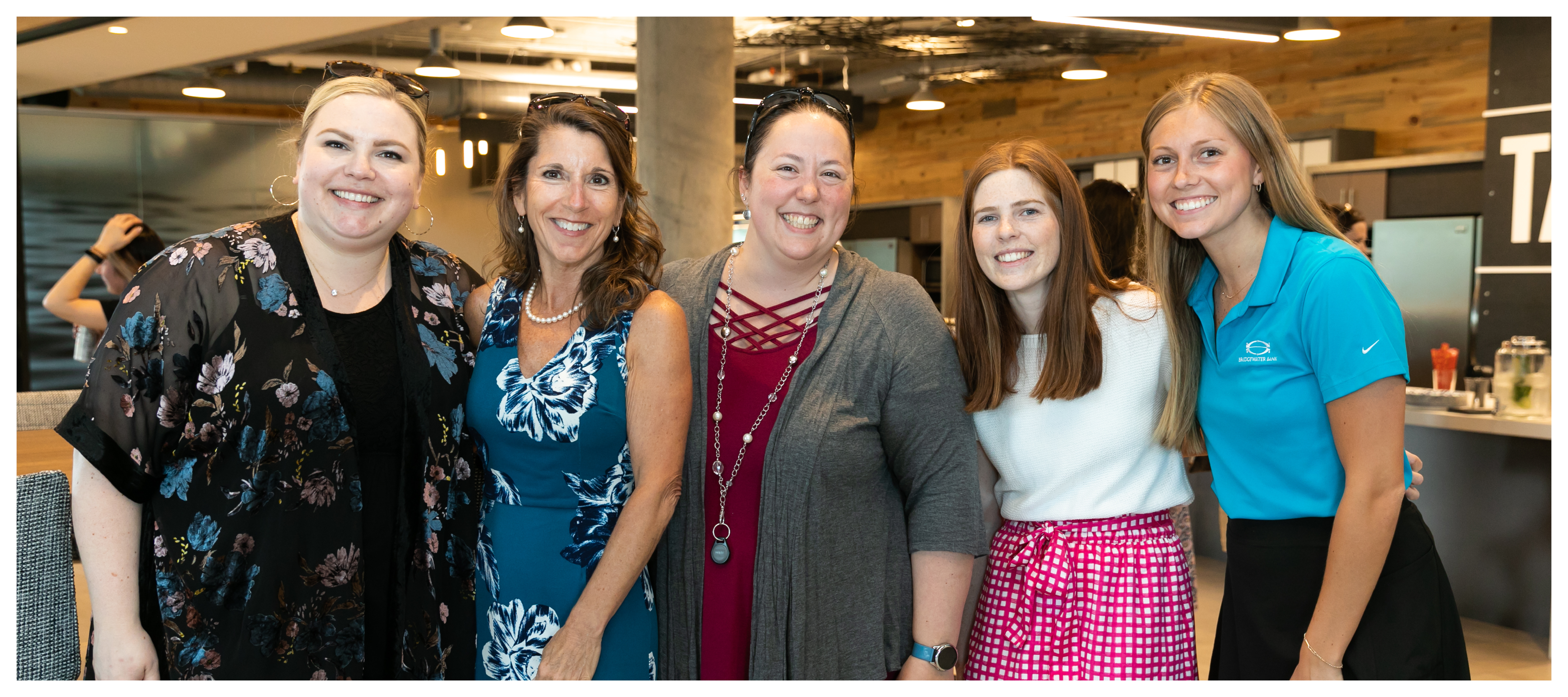 Group photo of Atom Metro Credit Union women at an internal happy hour.